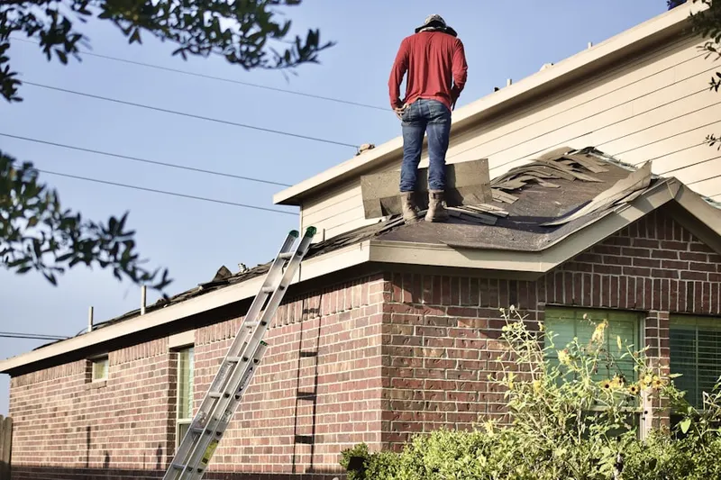 Professional roofer working on a residential roof in Saint Marys Seminary